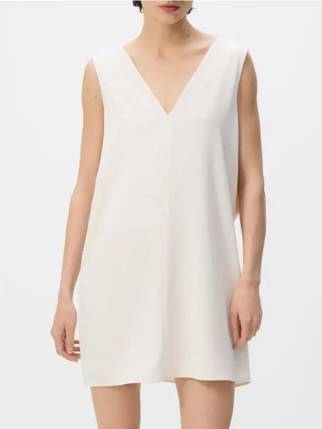 Abito con fiocco sulla schiena Colore panna